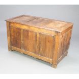 A 17th/18th Century oak coffer of panelled construction with hinged lid 64cm h x 112cm w x 65cm d