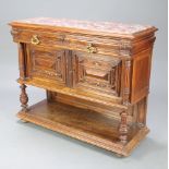 A 19th Century French carved walnut chiffonier with pink veined marble top above 2 short drawers,