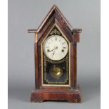 An American shelf clock with 16cm painted dial, contained in a mahogany Cathedral door style case