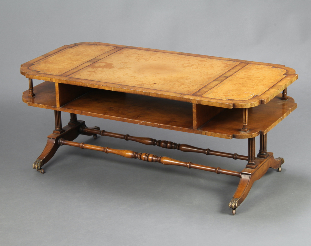 A Georgian style shaped mahogany 2 tier coffee table with inset writing surface, raised on 4