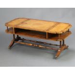 A Georgian style shaped mahogany 2 tier coffee table with inset writing surface, raised on 4
