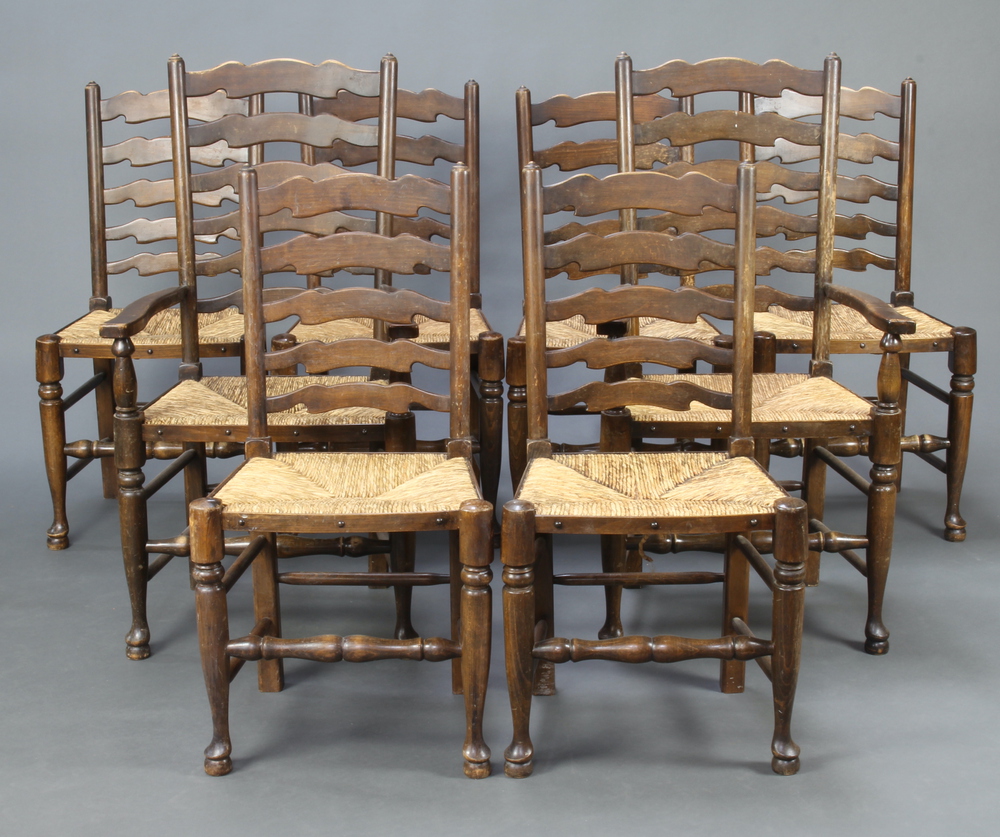 A set of 8 elm ladder back dining chairs with woven rush seats on turned supports comprising 2