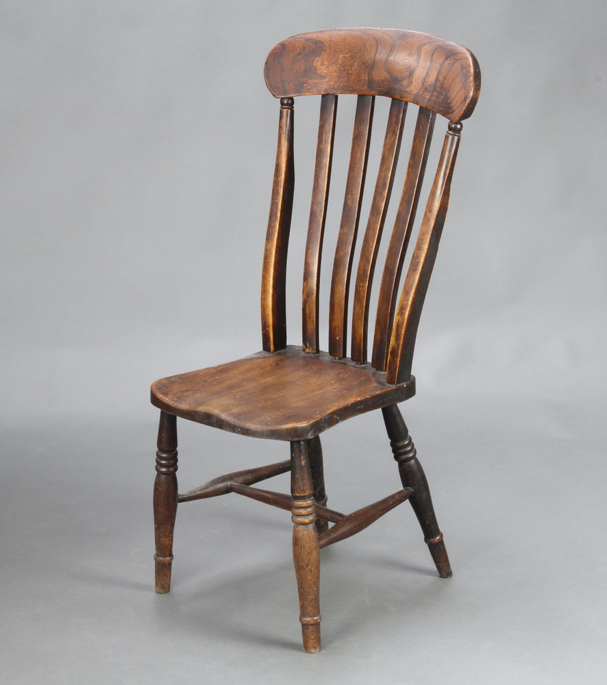 A 19th Century elm and beech stick and bar back Windsor chair, the solid seat marked CW, raised on