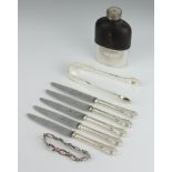 A silver plated mounted hip flask, a pair of silver sugar tongs, 5 butter knives and a moonstone