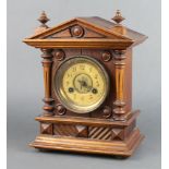 Junghans, an Edwardian striking mantel clock with paper dial and Arabic numerals contained in a