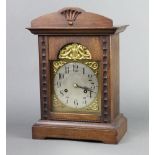 A Continental 8 day striking mantel clock with 15cm arched gilt dial, Arabic numerals and silvered