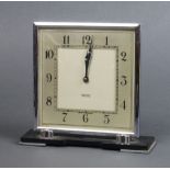 Smiths, an 8 day Art Deco timepiece with square silvered dial, contained in a chrome case 16cm h x
