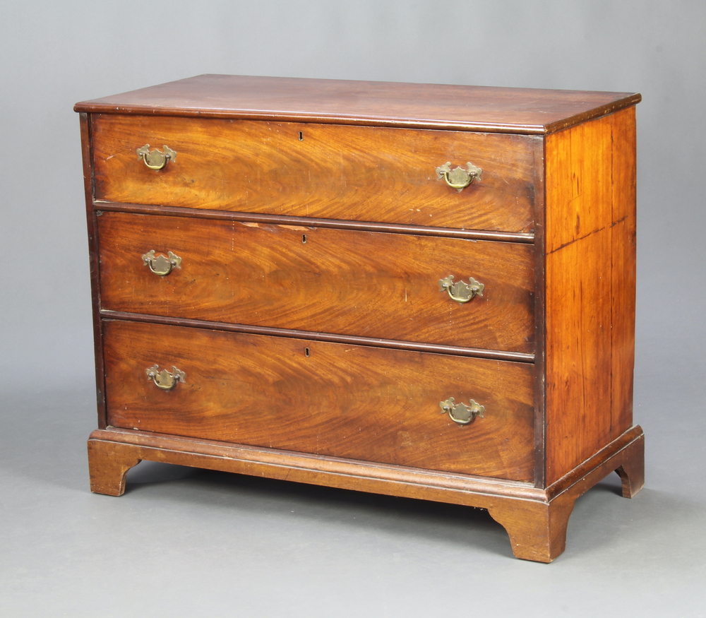 A 19th Century mahogany chest of 3 drawers with replacement brass drop handles, raised on bracket