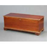 A 19th Century elm coffer with hinged lid, interior fitted a candle box, raised on bracket feet 49cm