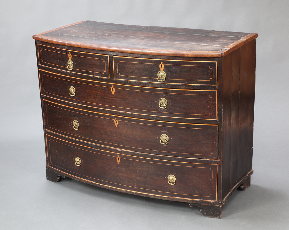 An 18/19th Century oak and mahogany bow front chest with crossbanded top and inlaid satinwood