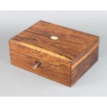 A rectangular Victorian rosewood trinket box with hinged lid and oval mother of pearl inlaid panel