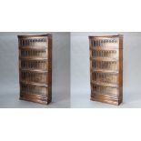 Globe Wernicke, a pair of oak Globe Wernicke 5 tier bookcases enclosed by folding lead glazed
