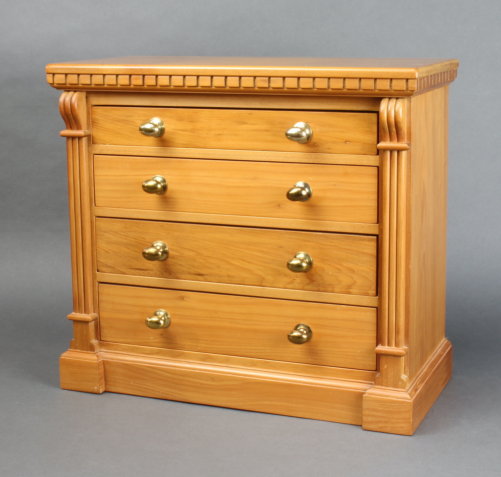 A Victorian style walnut collectors chest with dentil cornice and vitruvian scrolls to the side