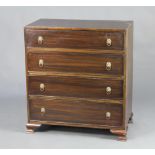 A 19th Century mahogany chest of 4 drawers with brass lion ring mask drop handles, raised on ogee