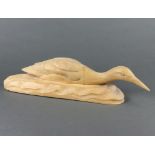 W Lang, a carved wooden figure of a duck in water, base marked W Lang April 2nd 1962 10cm x 49cm x