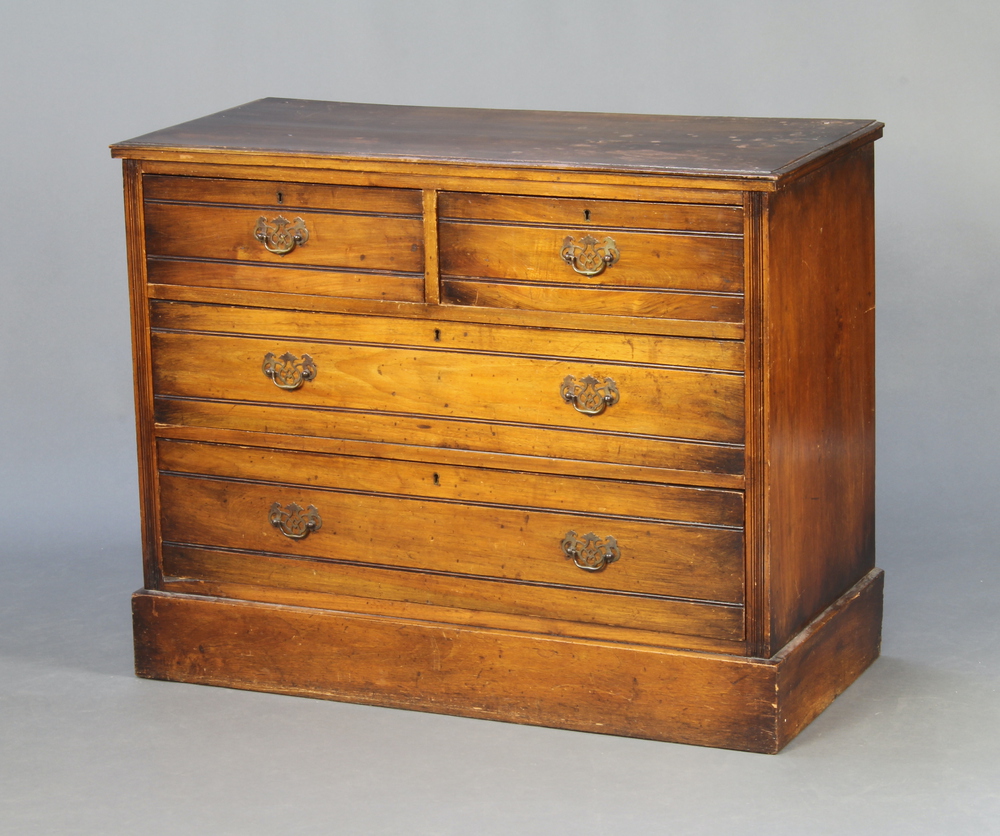 An Edwardian walnut chest of 2 short and 2 long drawers, raised on a platform base 83cm h x 104cm