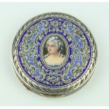 A 19th Century Continental 800 standard circular compact, the enamelled cover decorated with a
