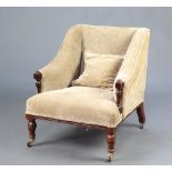 An Edwardian armchair upholstered in mushroom material, raised on turned supports 76cm h x 67cm w