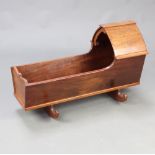 A 19th/20th Century mahogany dolls rocking crib 45cm h x 73cm w x 38cm d Contact marks in places