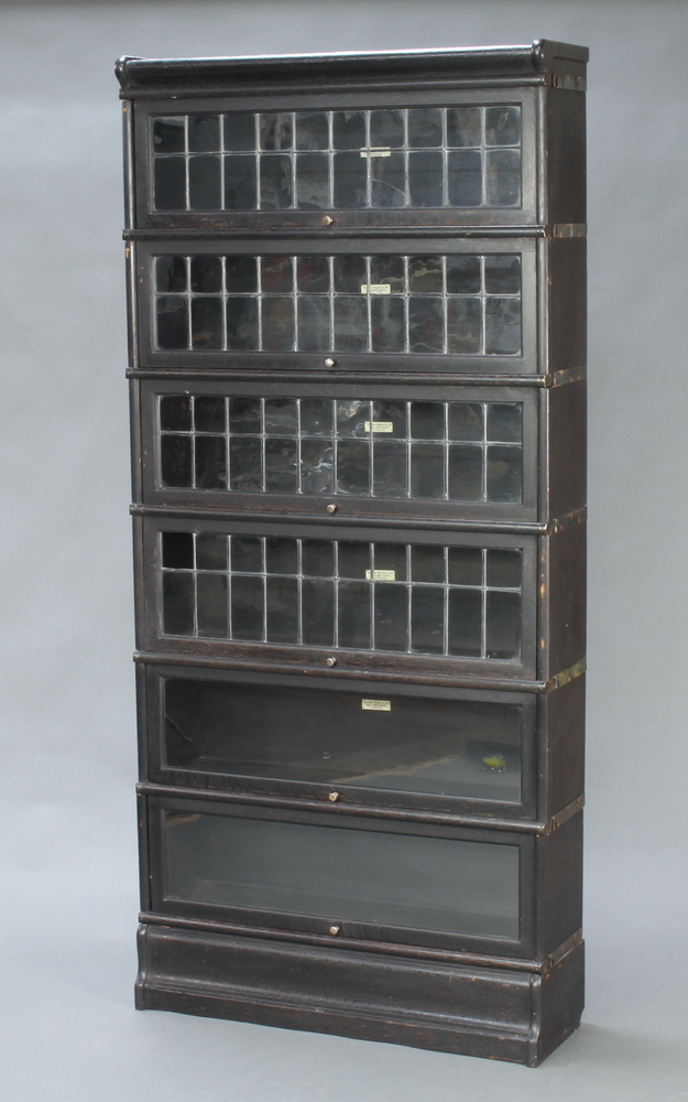 An ebonised oak 6 tier Globe Wernicke bookcase enclosed by lead glazed panelled doors 188cm h x 86cm - Image 2 of 3