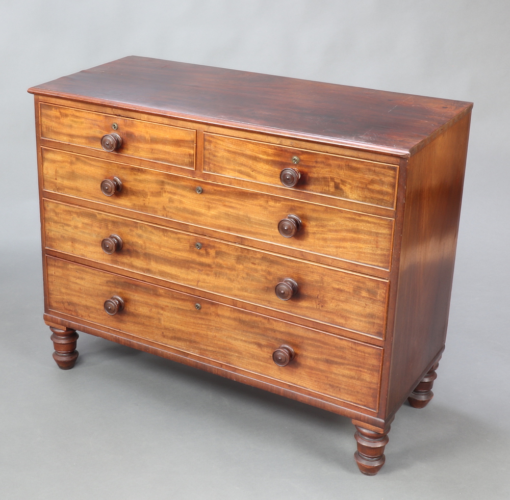 A 19th Century mahogany chest of 2 short and 3 long drawers with tore handles, raised on turned