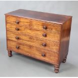 A 19th Century mahogany chest of 2 short and 3 long drawers with tore handles, raised on turned