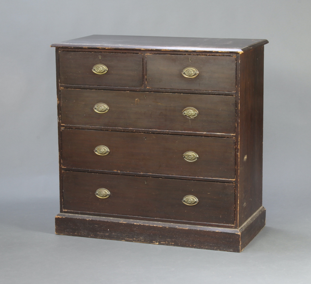 A Victorian ash chest of 2 short and 3 long drawers with brass drop handles, raised on a platform