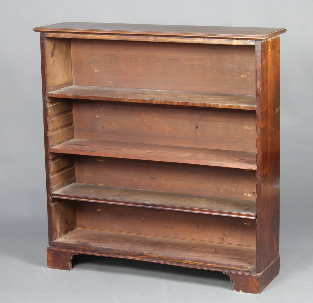 A Victorian mahogany open bookcase fitted adjustable shelves, raised on bracket feet 109cm h x 106cm