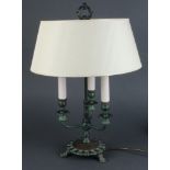 A Victorian style verdigris metal 3 light desk lamp raised on a circular foot 51cm h x 14cm d