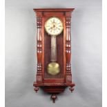 A Vienna style striking regulator with 18cm paper dial and gridiron pendulum, complete with key,