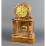 A Victorian French 8 day striking mantel clock with gilded dial and Roman numerals contained in a