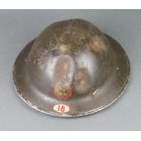 A Second World War National Fire Service steel helmet complete with liner, the interior marked