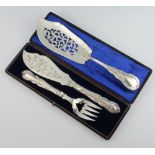 An Edwardian silver plated lily pattern fish slice together with a cased pair of fish servers