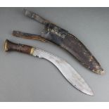 A military style Kukri with 28cm unmarked blade contained in a leather scabbard with leather
