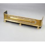 A Victorian pierced brass fender 23cm h x 97cm w x 15cm d