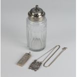 A Georgian silver mounted cut glass shaker 12cm, an ingot and white metal House of Commons style