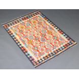 A white, green and orange ground Chobi Kilim rug 143cm x 102cm