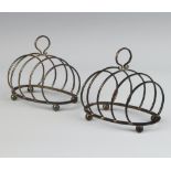 A pair of silver 5 bar oval toast racks, Birmingham 1922, 9.5cm, 112 grams