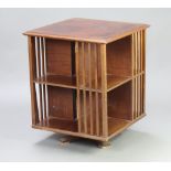 An Edwardian square quarter veneered and crossbanded mahogany 2 tier revolving bookcase 68cm h x