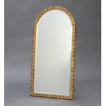 An arch shaped bevelled plate mirror contained in a gilt frame 91cm h x 44cm w