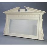 An Edwardian rectangular bevelled plate over mantel mirror contained in a white painted neo