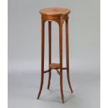 An Edwardian, Georgian style circular 2 tier mahogany jardiniere stand raised on outswept supports