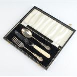 A cased silver christening fork and spoon Birmingham 1961 together with a knife, cased