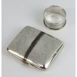 A silver engraved cigarette case Birmingham 1918 together with a napkin ring, gross weight 106 grams