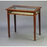An Edwardian rectangular inlaid mahogany bijouterie table, with plush lining, raised on square