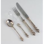 A set of Continental white metal cutlery comprising knife, fork, tea spoon, coffee spoon