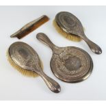 A 4 part silver dressing table set comprising hand mirror, 2 clothes brushes and a comb (a/f),