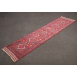 A red and blue ground Meshwani runner with 6 diamonds to the centre 260cm x 62cm