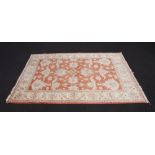 An orange and white ground floral pattern Afghan rug 202cm x 151cm