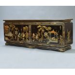 A 20th Century Chinese lacquered sideboard the base enclosed by a pair of panelled doors decorated